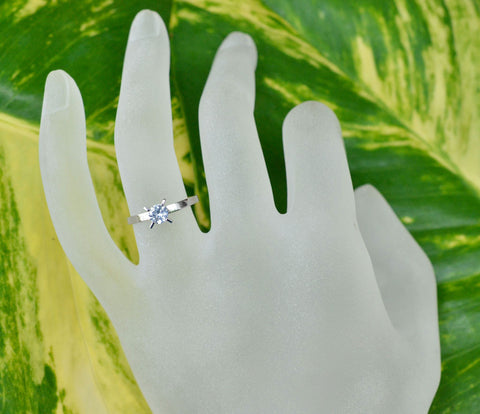 Solitaire ring featuring Ceylon white sapphire