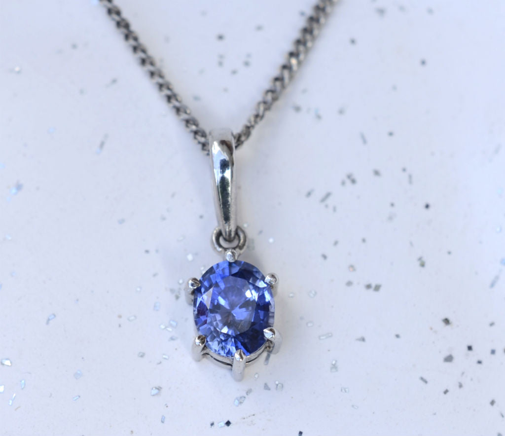 Natural oval Ceylon blue sapphire pendant in 18K white gold available at Elizabeth Jewellers in Sri Lanka