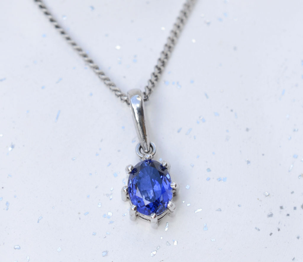 Natural oval Ceylon blue sapphire 18K white gold pendant available at Elizabeth Jewellers in Sri Lanka