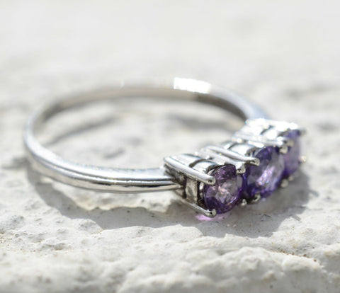 3 Natural Ceylon Purple Sapphires prong set on 18K white gold ring available to buy at Elizabeth Jewellers in Sri Lanka