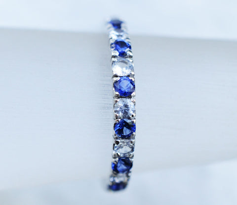 18K white gold Ceylon blue and white sapphire eternity ring perfect for a wedding ring.
