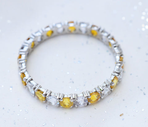 Natural Ceylon Yellow and White sapphire eternity ring in 18K white gold