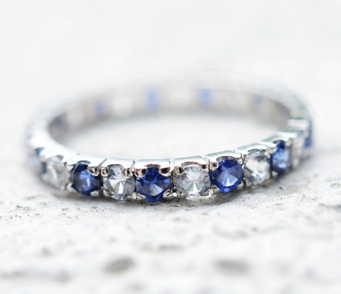 Ceylon blue and white sapphire 18K white gold eternity ring perfect for a wedding ring.