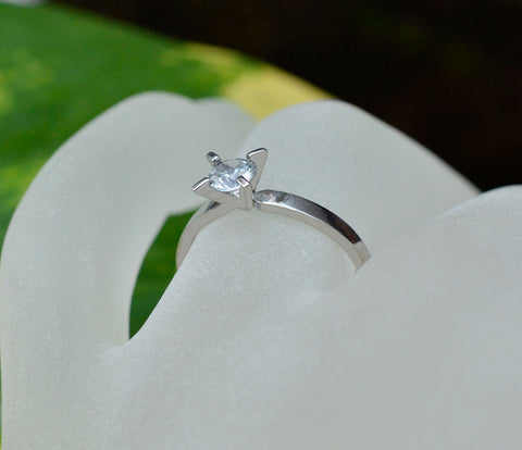 White gold white sapphire solitaire ring
