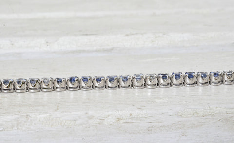 Singe flexible straight line design sapphire bracelet with different shades of natural Ceylon blue and white sapphires