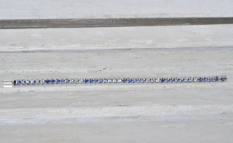 White gold sapphire bracelet in different shades of blue sapphires
