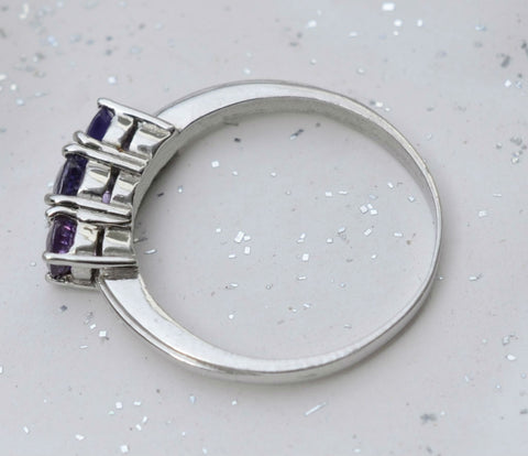 3 Natural Ceylon Purple Sapphires prong set on 18K white gold ring available to buy at Elizabeth Jewellers in Sri Lanka