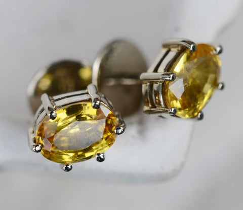 Oval Ceylon yellow sapphire earrings in 18K yellow gold available at Elizabeth Jewellers in Sri Lanka