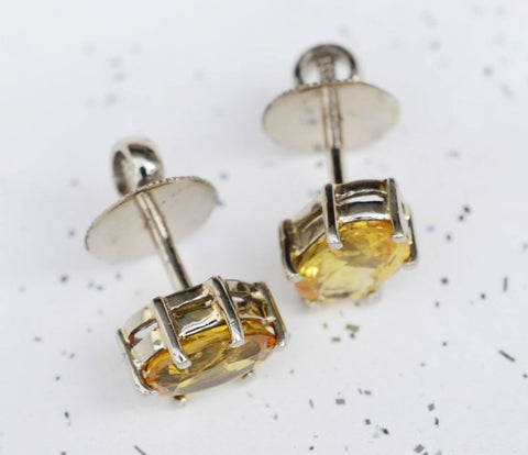 Oval Ceylon yellow sapphire 18K yellow gold earrings available at Elizabeth Jewellers in Sri Lanka