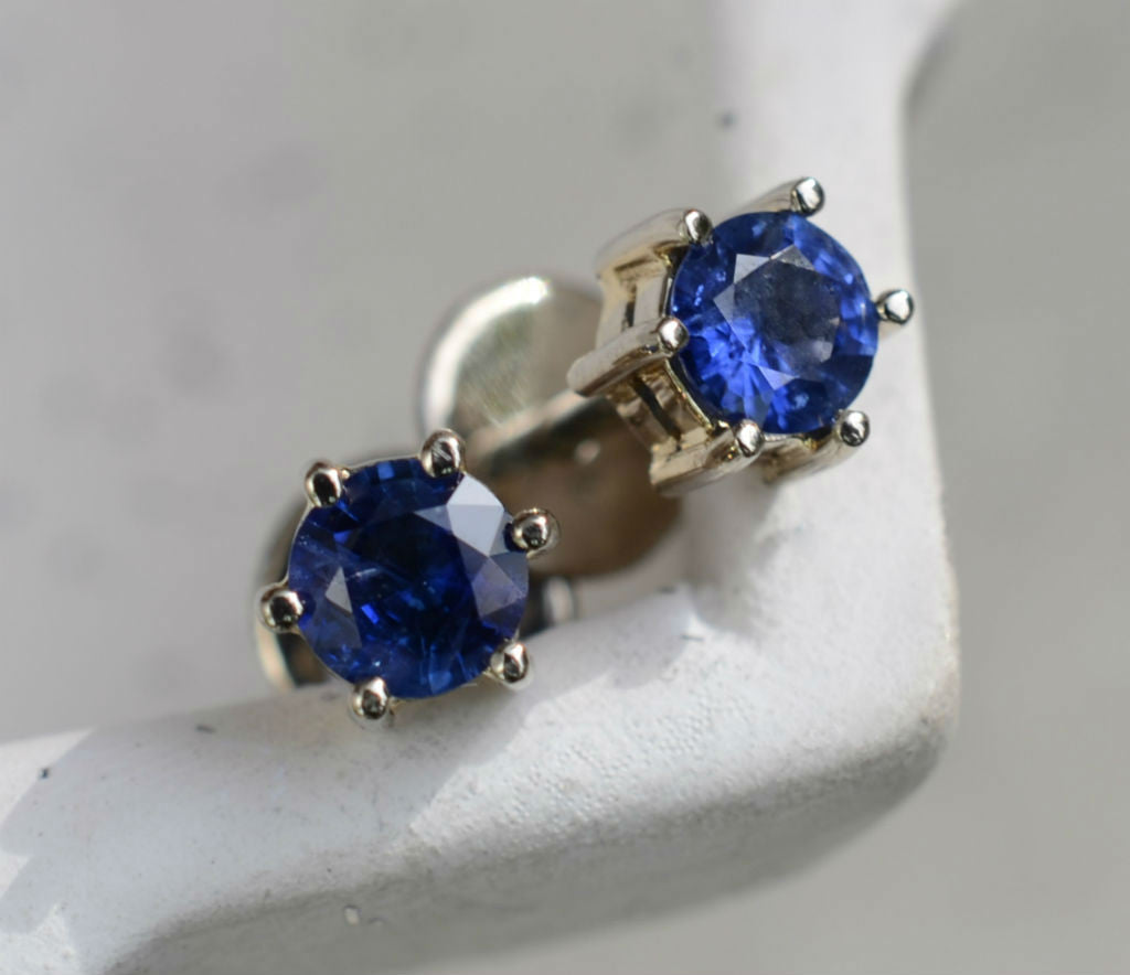 Round Ceylon blue sapphire earrings in 18K white gold available at Elizabeth Jewellers in Sri Lanka