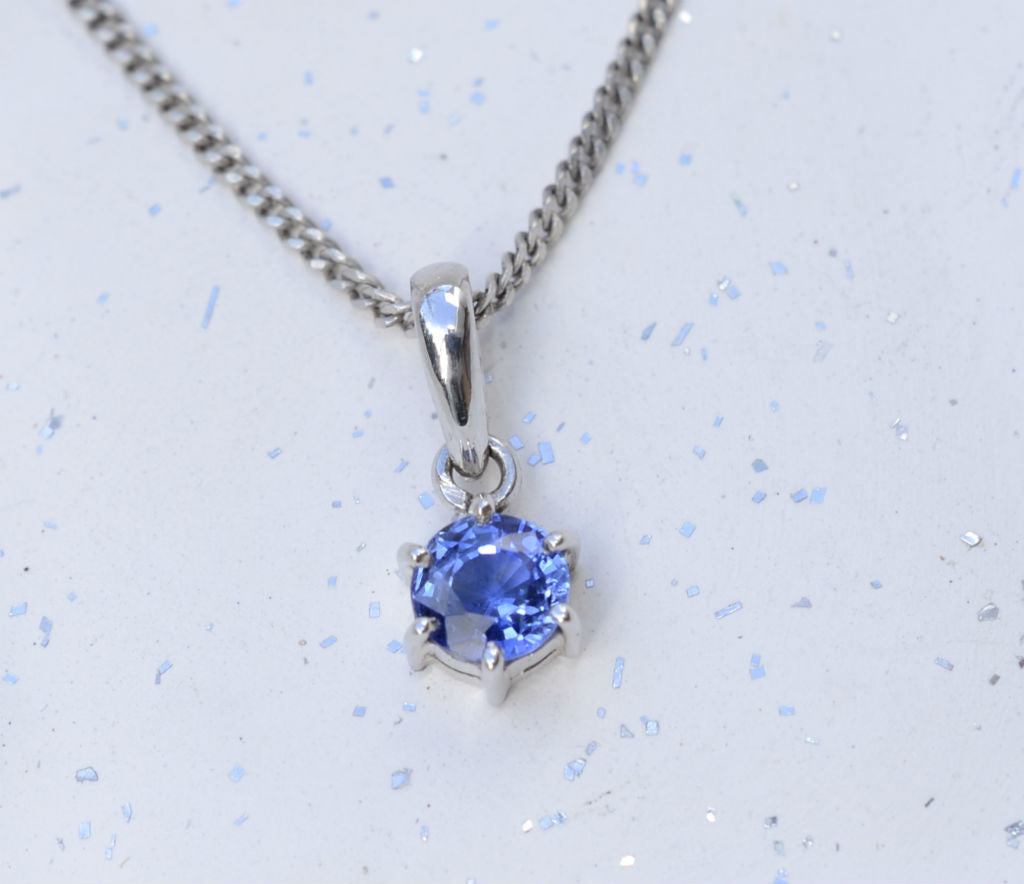 Natural round Ceylon blue sapphire 18K white gold pendant available at Elizabeth Jewellers in Sri Lanka