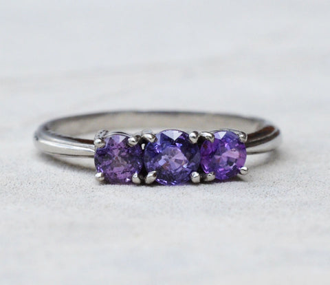 3 Natural Ceylon Purple Sapphires prong set on 18K white gold ring available to buy at Elizabeth Jewellers in Sri Lanka