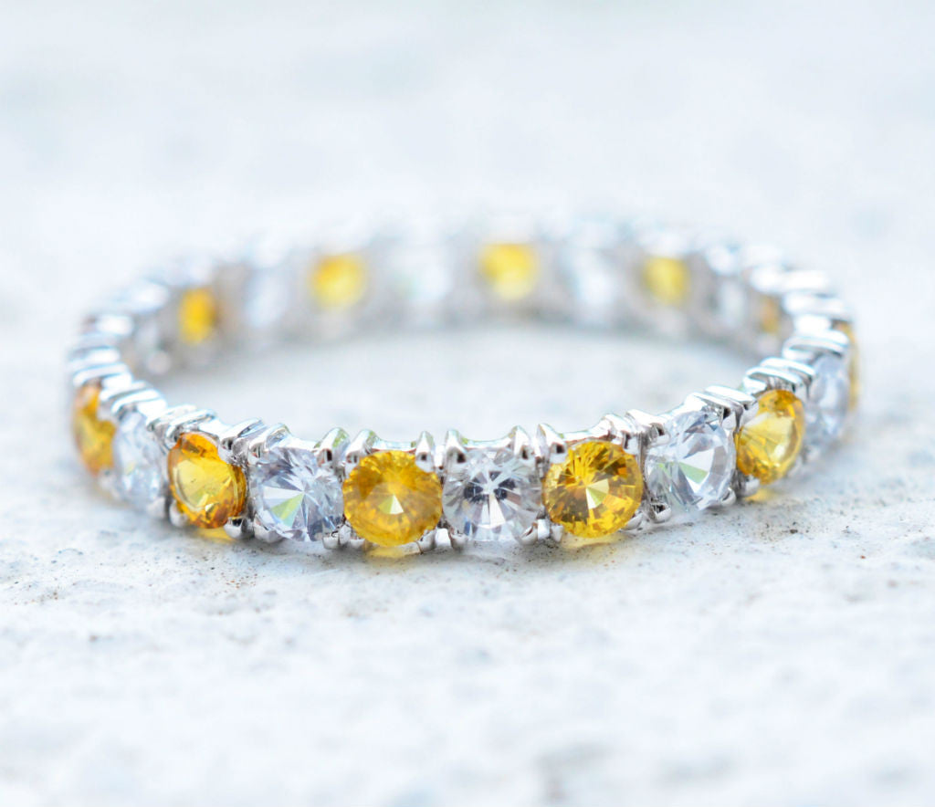 Natural Ceylon Yellow and White sapphire eternity ring in 18K white gold
