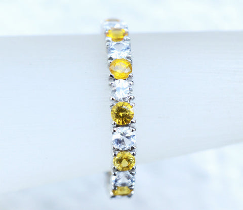 Natural Ceylon Yellow and White sapphire eternity ring in 18K white gold
